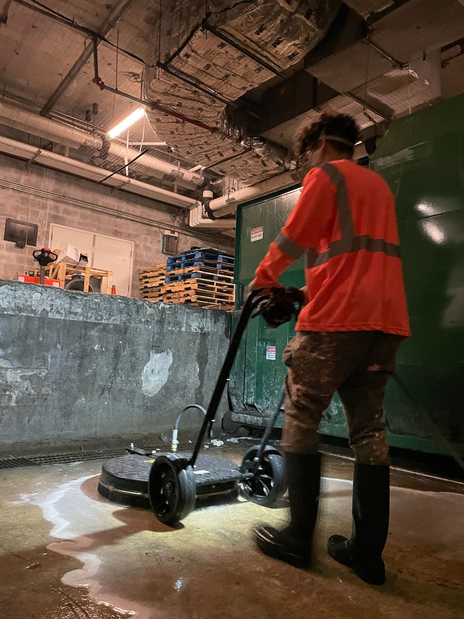 Crew pressure washing a commercial floor — Finesse Cleaning, South Florida