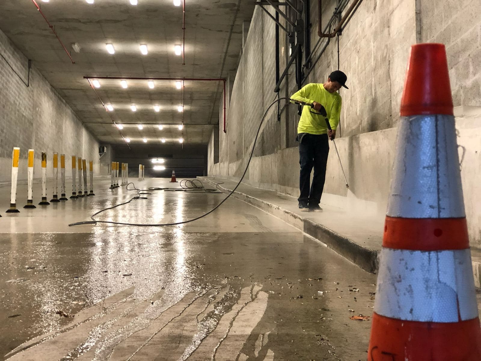 Crew pressure washing a parking garage — Finesse Cleaning, South Florida