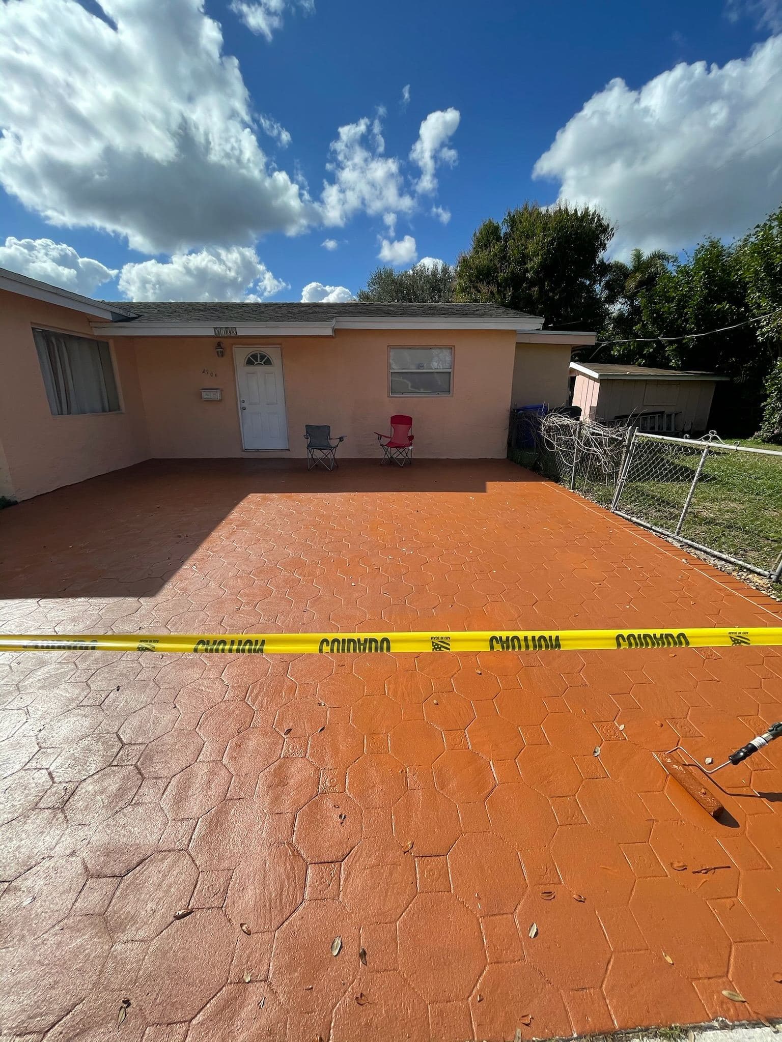 Freshly sealed paver driveway in a warm terracotta tone — Finesse Cleaning, South Florida