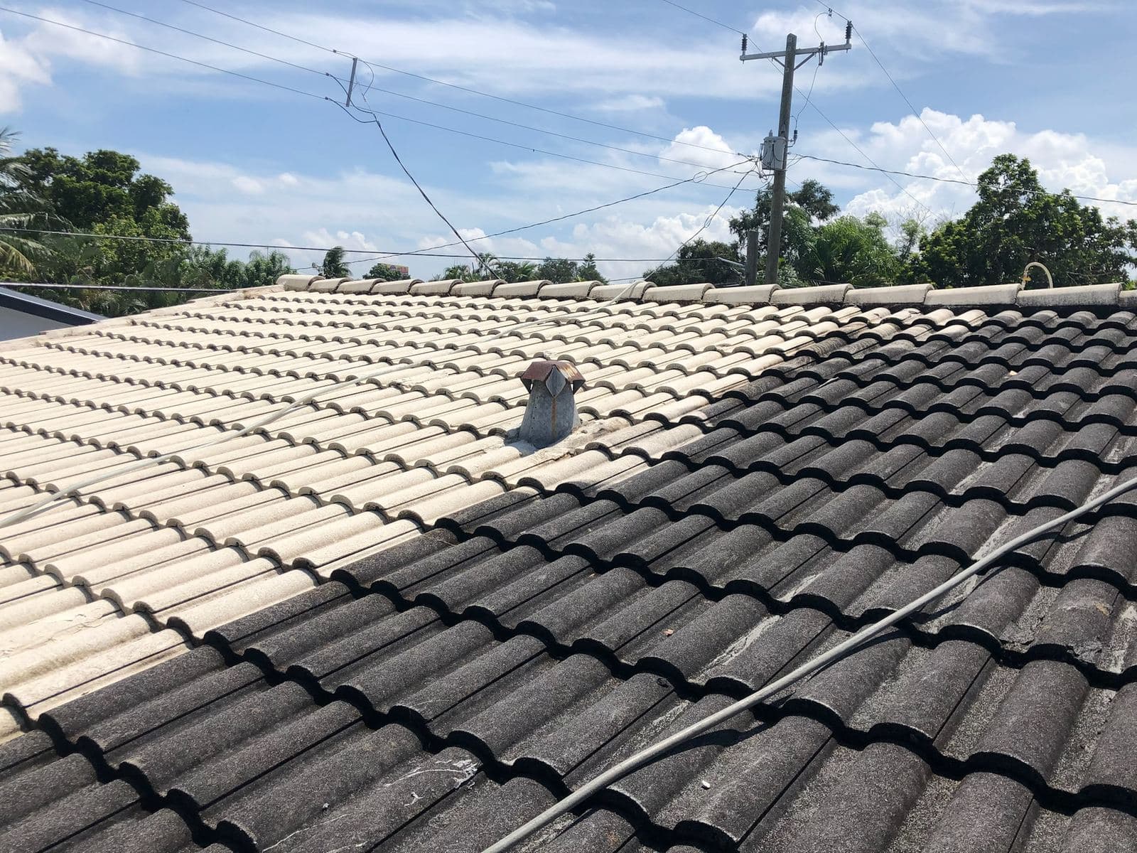 Dark tile roof before soft washing — Finesse Cleaning, South Florida