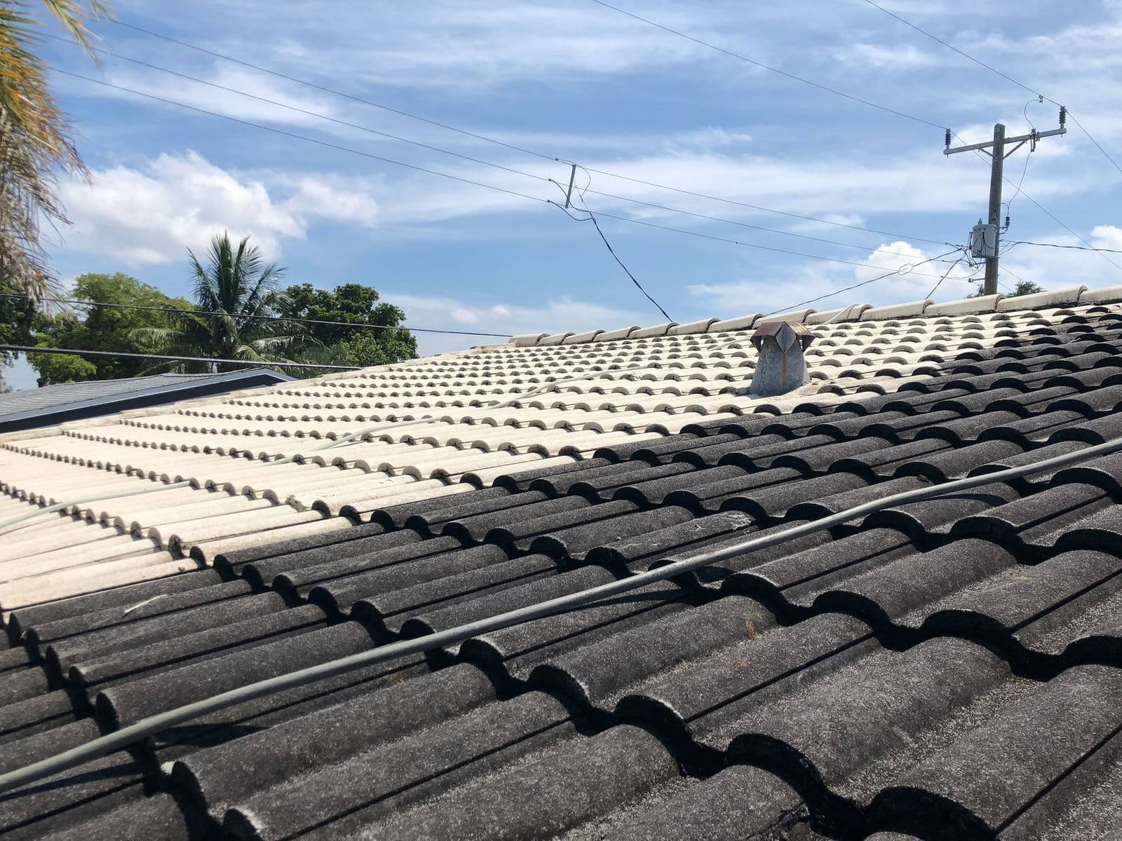 Dark tile roof before soft washing — Finesse Cleaning, South Florida